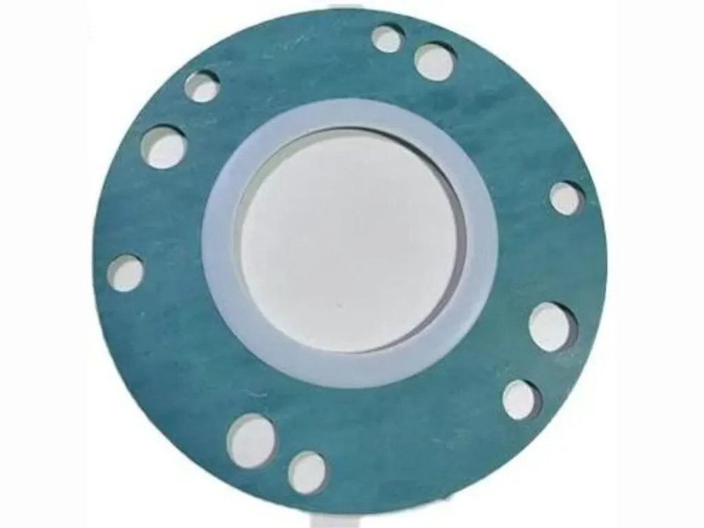 Gioăng bọc ptfe lõi không amiang: vành PTFE trên tấm bìa xanh có lỗ bu lông